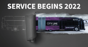 A promotional image showcases a digital rendering of the new City Line bus for Spokane Transit, underscoring its journey from concept design to real-life vehicle. The stylish black and purple bus features "Battery Electric" on its side. Bold text at the top proclaims, "CITY LINE SERVICE BEGINS 2022.