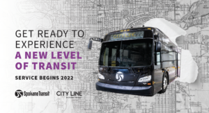 Promotional poster for Spokane Transit's new City Line service starting in 2022. A modern city bus is featured prominently against a background of a city map. Text on the left reads, "Get ready to experience a new level of transit with City Line. Service begins 2022.
