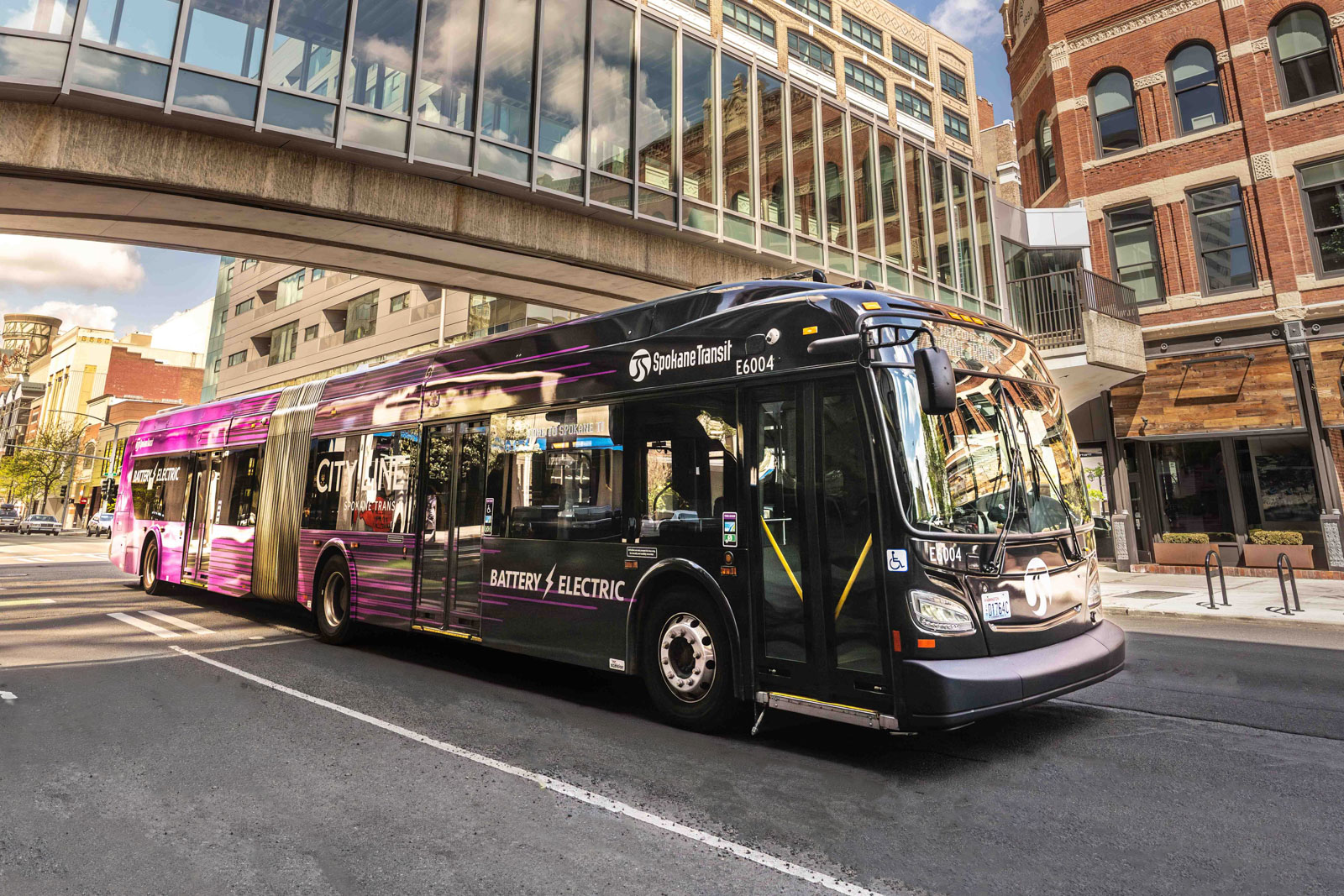 picture of city line bus driving downtown