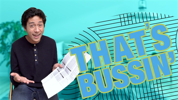 A person with dark hair, wearing a navy blue shirt, is sitting and holding papers with an expressive look. To the right, bold yellow text reads "THAT'S BUSSIN'" on a teal background with vertical lines. The background includes a muted building and tree.