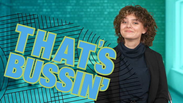 A young person with curly hair and wearing a blazer smiles while sitting in front of a teal background with a window. The bold text "THAT'S BUSSIN'" appears in bright blue and yellow with dynamic black lines radiating from the text.