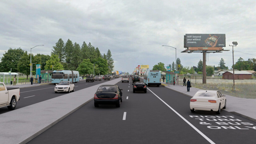 Render of a multilane urban road with varied traffic including cars and Spokane Transit buses, bordered by trees and advertising billboards under a cloudy sky.