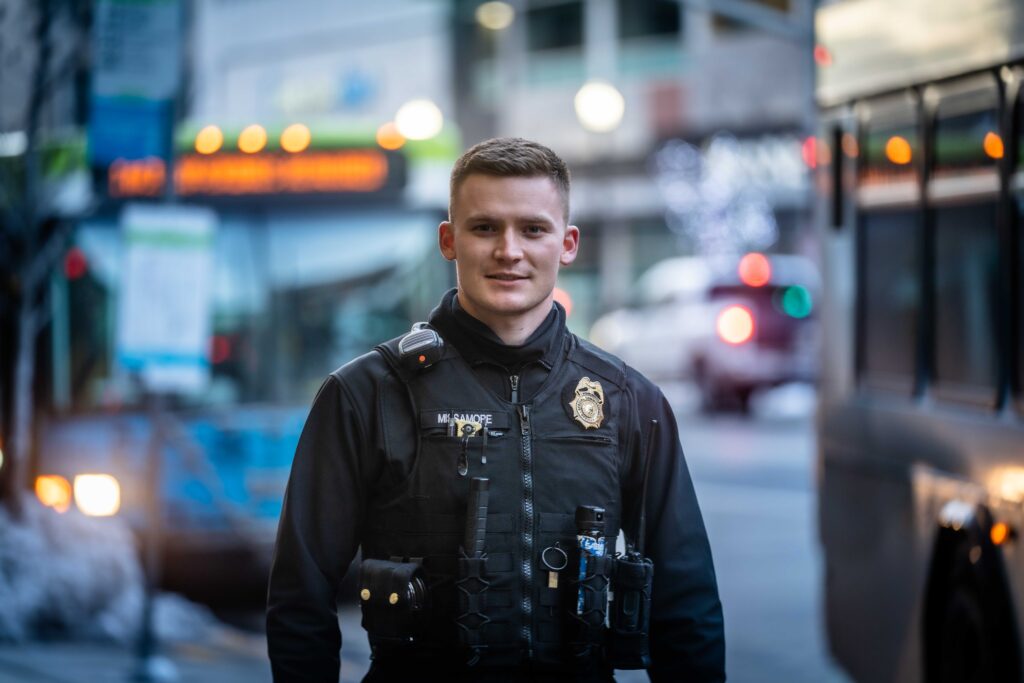 An STA Transit Officer standing outside.