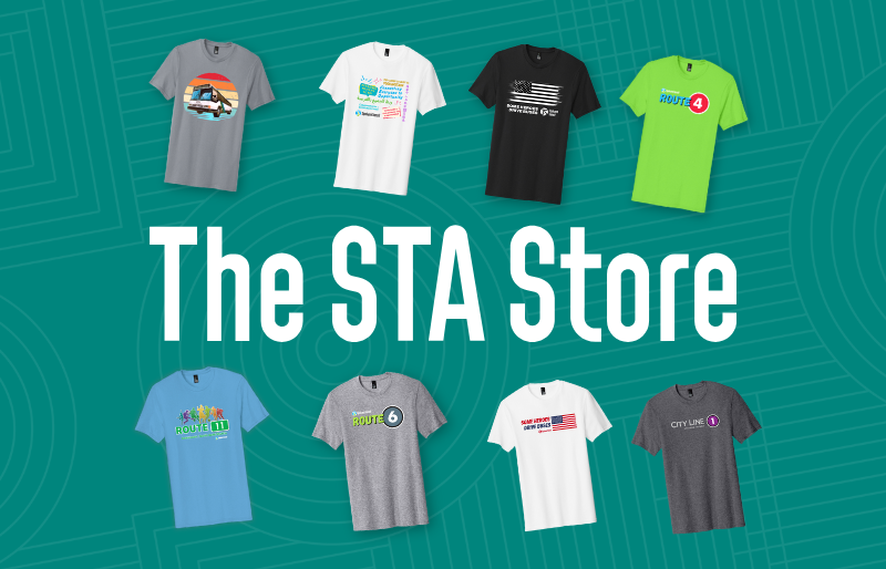 Eight colorful t-shirts with different designs are shown above the text "The STA Store" on a teal background.