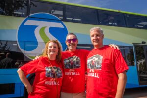 STA's Chief Communications and Customer Service Officer Carly Cortright, Chief Operations Officer Brandon Rapez-Betty, and Deputy Chief Operations Officer Andy Casper gather to commemorate the successful ribbon-cutting event and double-decker service launch.