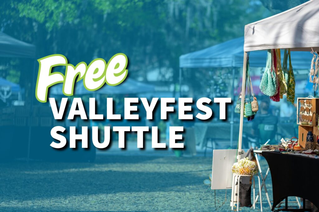 Free Valleyfest Shuttle" on a festival scene with vendor tents and crafts.