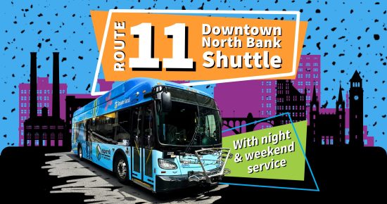 A blue bus on Route 11 with text "Downtown North Bank Shuttle" and "With night & weekend service" on a colorful background.