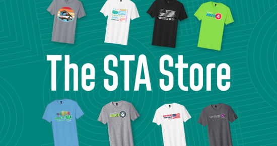 Eight colorful t-shirts with different designs are shown above the text "The STA Store" on a teal background.
