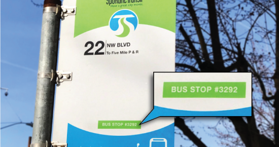An image of the Bus Stop information sign showing where to find the Text Stop number.
