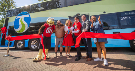 EWU mascot Swoop, City of Medical Lake Council Member and STA Board Member Lance Speirs, EWU President Shari McMahan, STA CEO Karl Otterstrom, City of Cheney Mayor and STA Board Member Chris Grover, and City of Spokane Council President and STA Board Member Besty Wilkerson cut the red ribbon to officially kick off double-decker service.